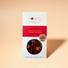 Cranberry & Apricot Dark Chocolate Bar on a warm beige background.