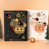Collector’s pair of luxury Christmas Chocolate Advent Calendars by Honest Chocolat in black and gold and white and bronze, each filled with 24 handcrafted chocolates.