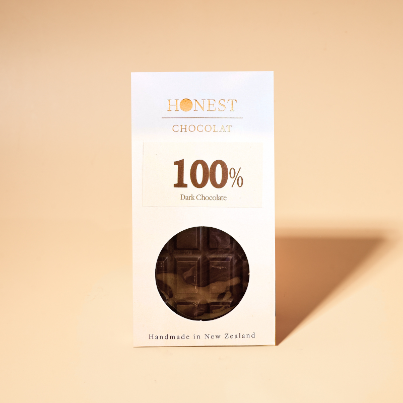 Honest Chocolat 100% Cacao - Dark Chocolate Bar on a beige background