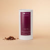 Honest Chocolat cacao tea canister on a beige background
