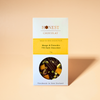 Mango & Pistachio Dark Chocolate Bar on a warm beige background