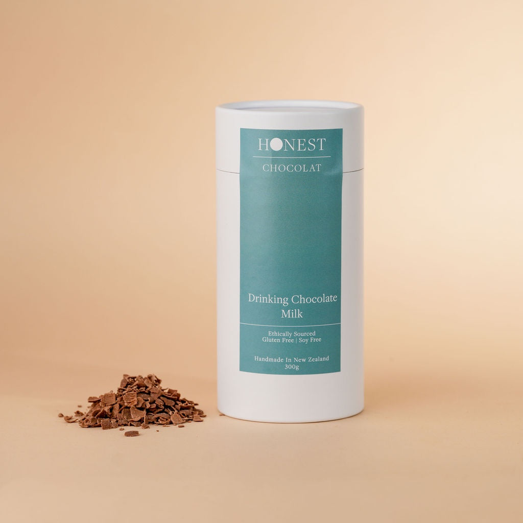 Honest Chocolat milk drinking chocolate canister on a beige background