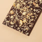 Close-up of Orange & Macadamia - Dark Chocolate Bar - 64% Cacao