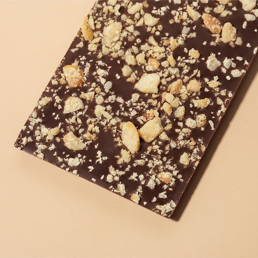 Close-up of Orange & Macadamia - Dark Chocolate Bar - 64% Cacao