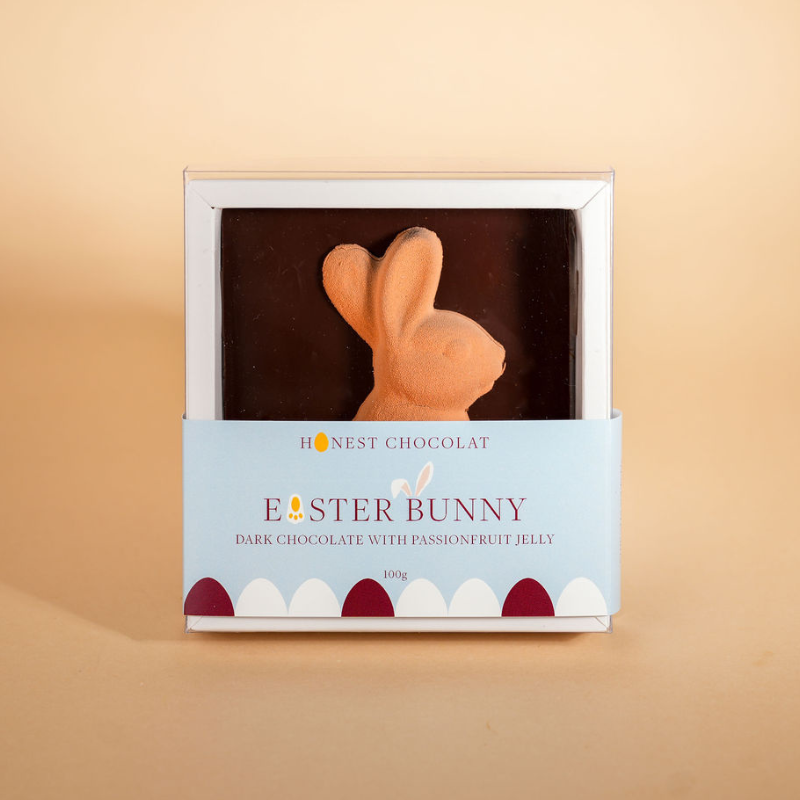 Chocolate Easter bunny in a box with 'Honest Chocolat' branding on a beige background