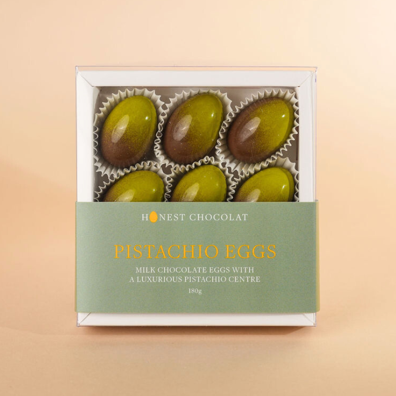 Box of Honest Chocolat Pistachio Eggs on a beige background