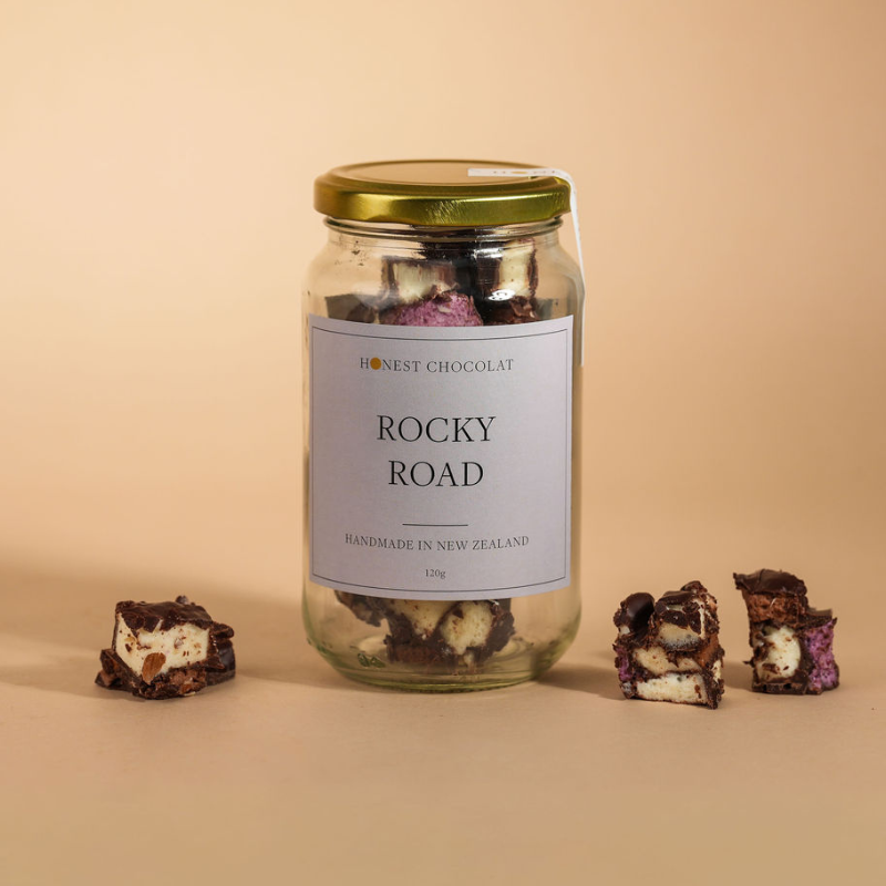 Jar of Rocky Road with a label on a beige background