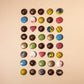 Assorted chocolate bonbons from Honest Chocolat, with each bonbon uniquely shaped and colored