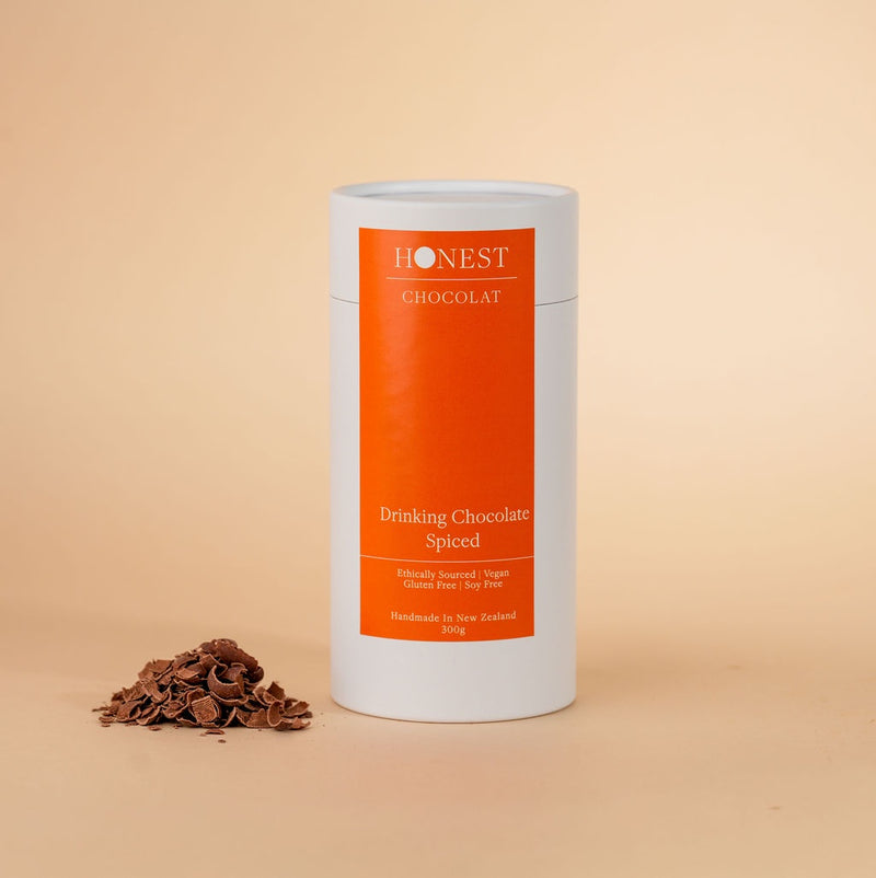 Honest Chocolat spiced drinking chocolate canister on a beige background