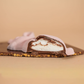Chocolate-covered treat with a marshmallow center on a beige background