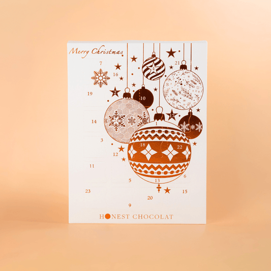 Premium white and bronze Christmas Chocolate Advent Calendar by Honest Chocolat, 24 artisan chocolates handcrafted in New Zealand.